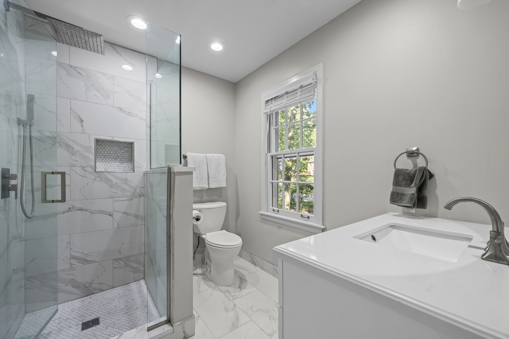 1010 South Green Bay Road Lake Forest, IL 60045 - Photo 14 of 25 a bathroom with a sink toilet and shower