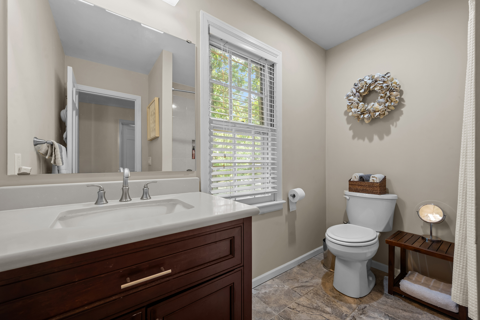 1010 South Green Bay Road Lake Forest, IL 60045 - Photo 20 of 25 a bathroom with a toilet a sink and a large mirror