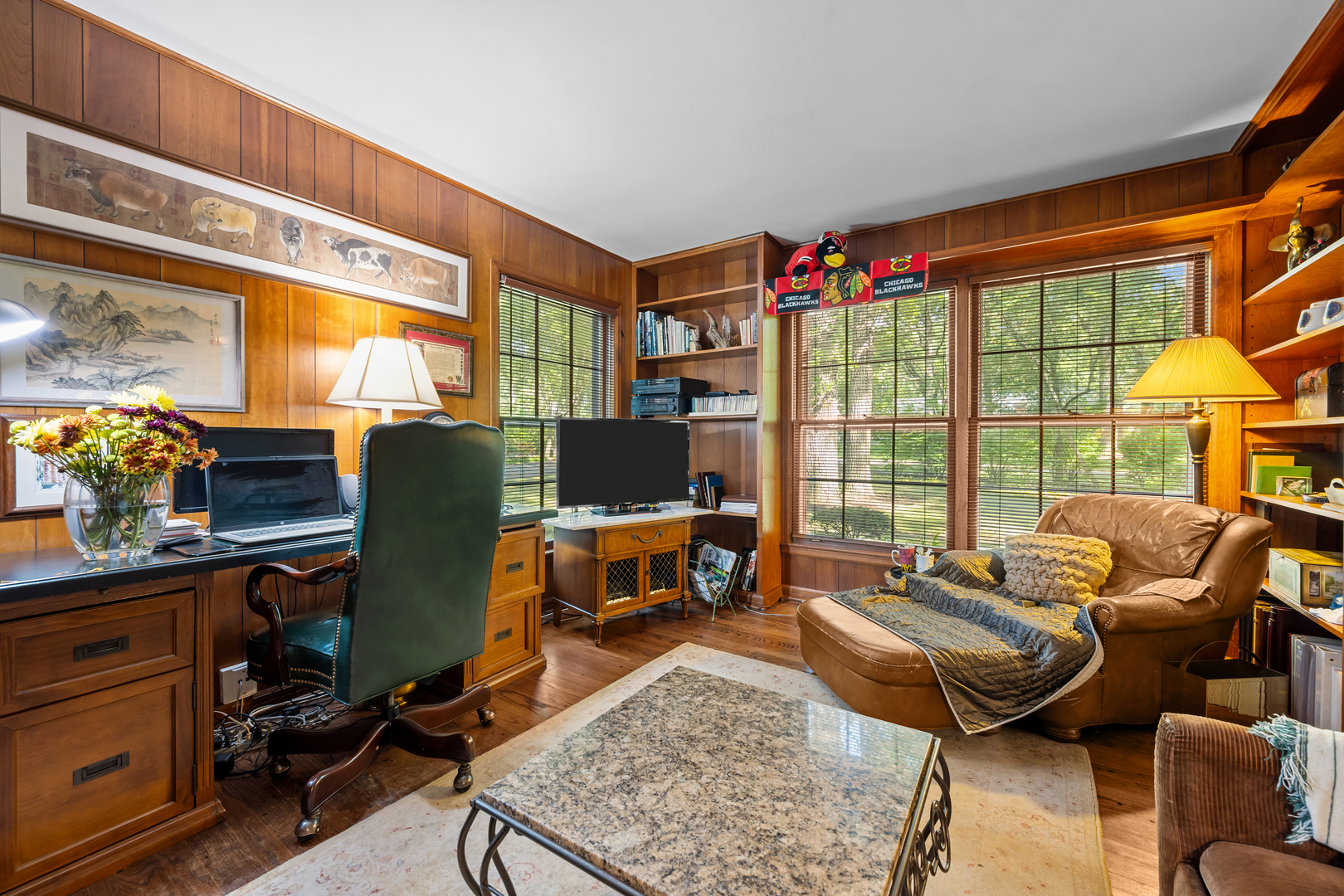 1010 South Green Bay Road Lake Forest, IL 60045 - Photo 10 of 25 a living room with furniture a flat screen tv and a floor to ceiling window