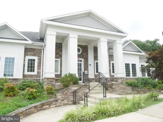 a view of a livingroom with furniture and chandelier