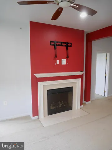 a view of empty room with a fireplace