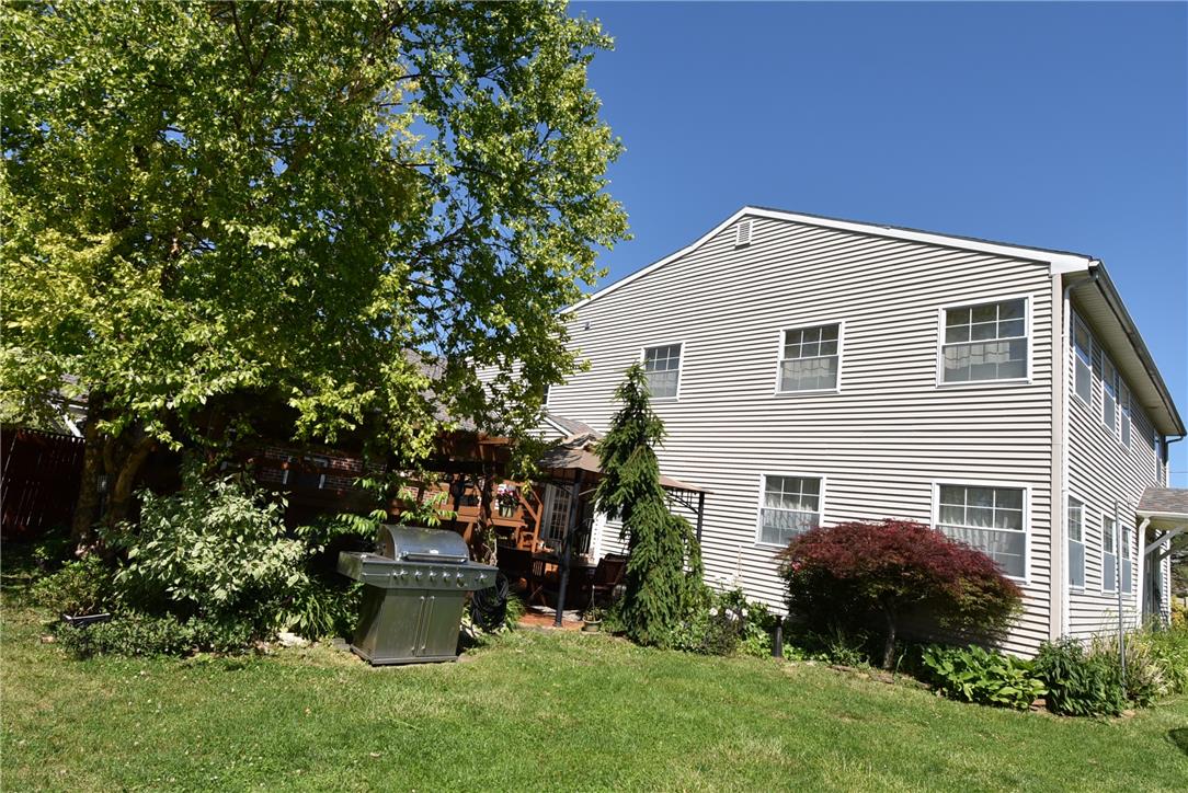 424 Grape Street Whitehall, PA 18052 - Photo 42 of 50 A well-maintained lawn and mature trees frame the outdoor entertaining space.