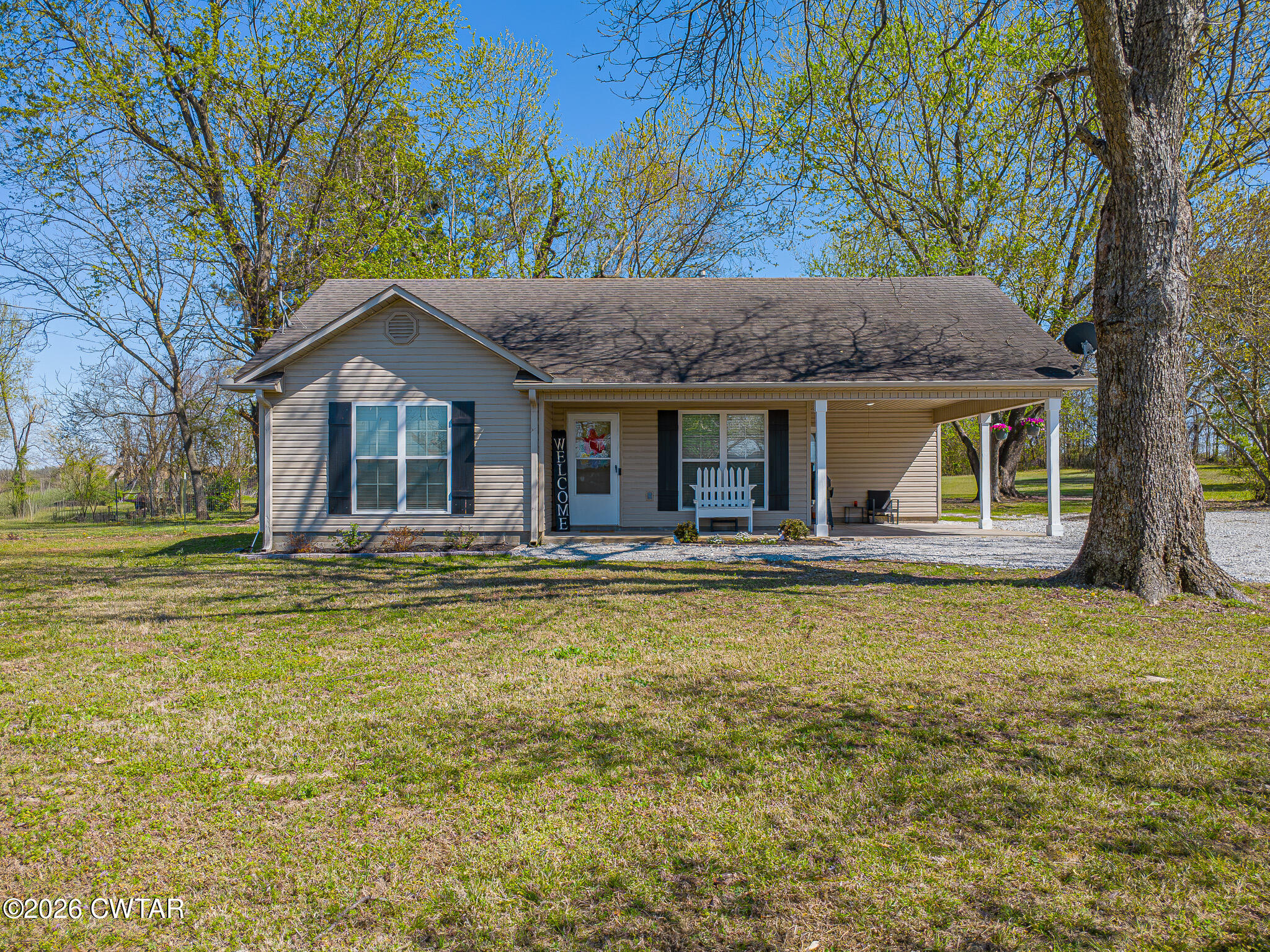 916 Landfill Road Brownsville, TN 38012 - Photo 1 of 21 a front view of a house with swimming pool table and chairs