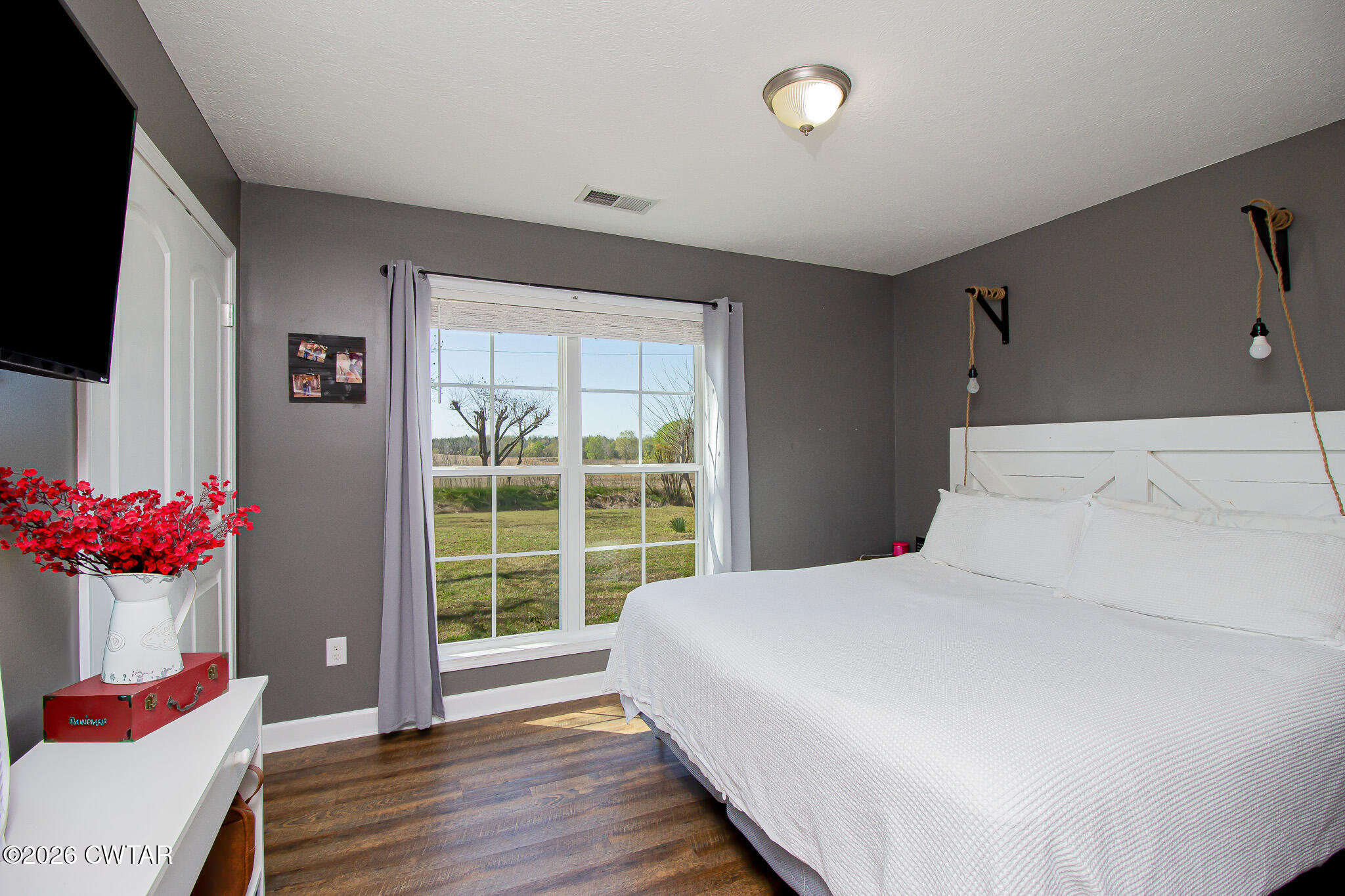 916 Landfill Road Brownsville, TN 38012 - Photo 12 of 21 a bedroom with a bed and a large window