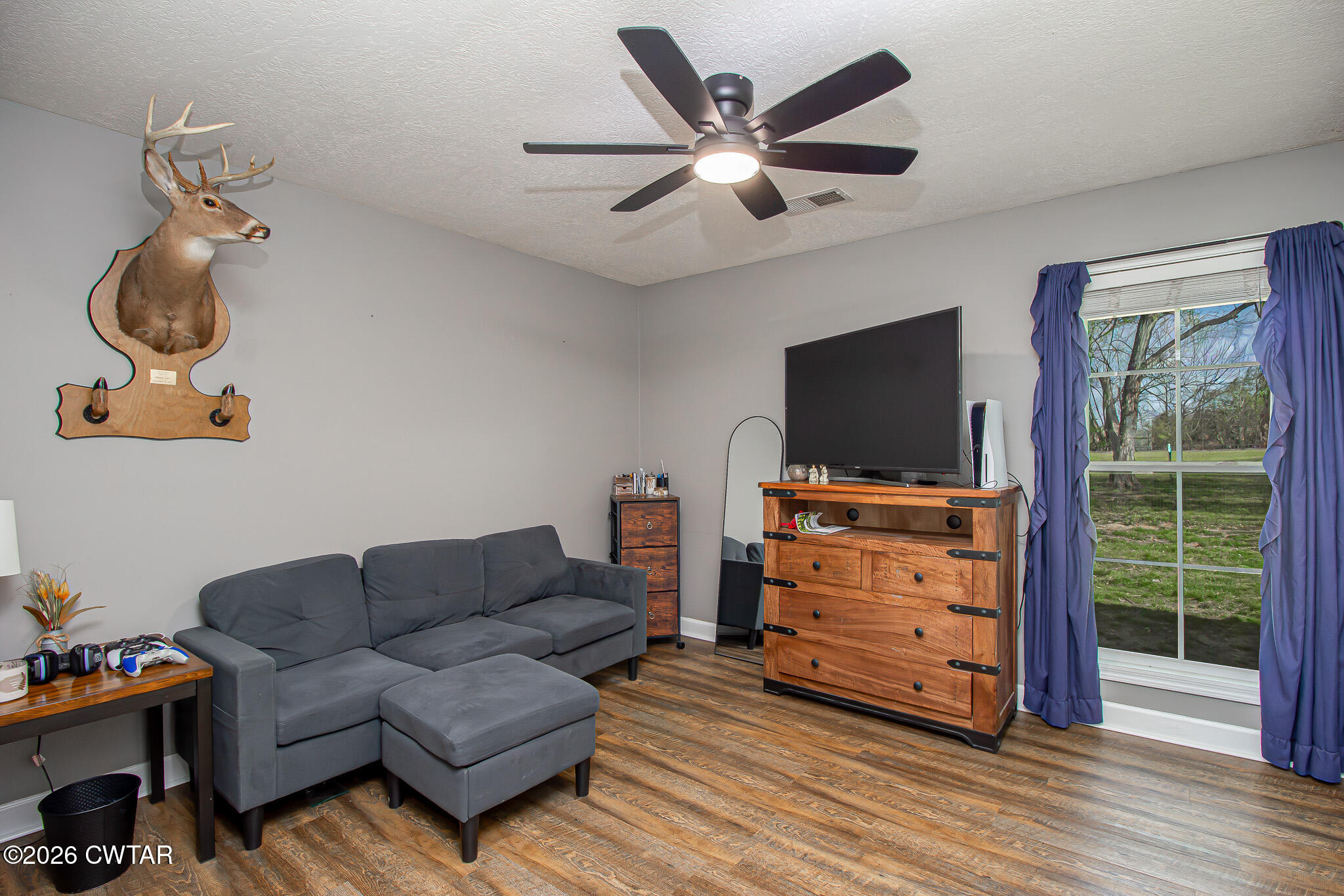 916 Landfill Road Brownsville, TN 38012 - Photo 13 of 21 a living room with furniture and a flat screen tv