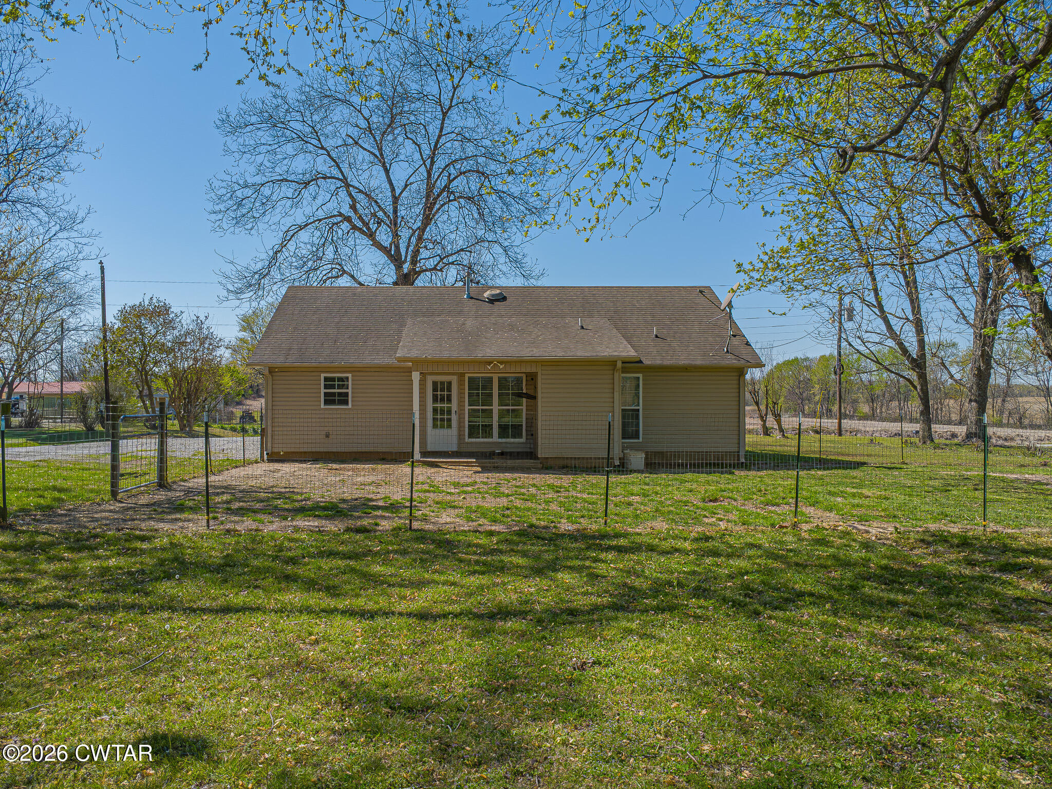 916 Landfill Road Brownsville, TN 38012 - Photo 14 of 21 a house with huge green field