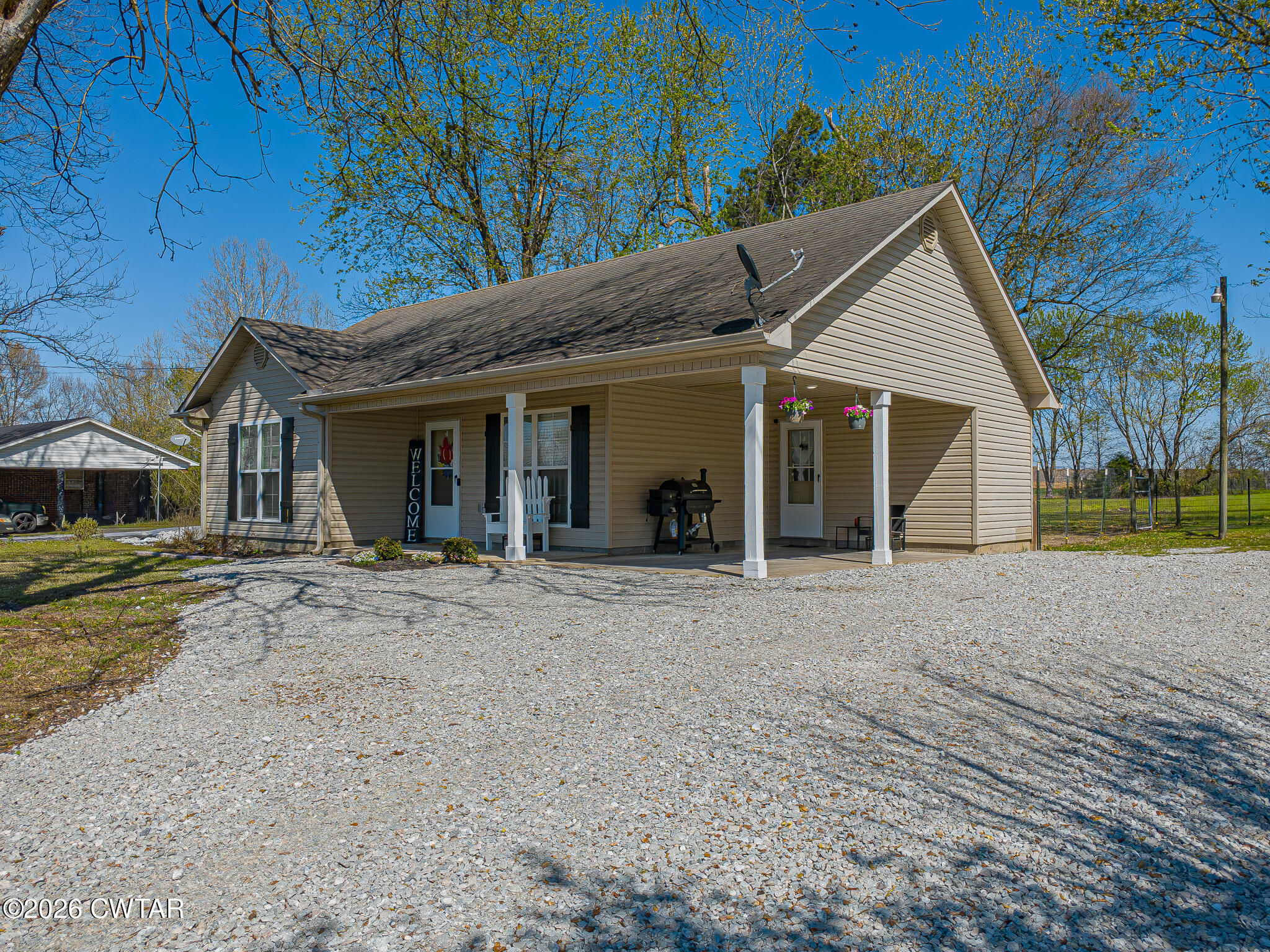 916 Landfill Road Brownsville, TN 38012 - Photo 5 of 21 a view of a house with a yard and potted plants