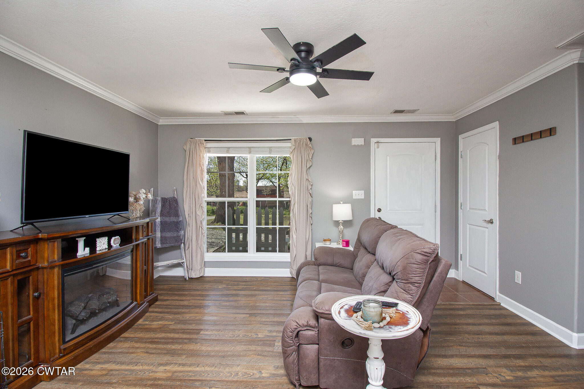 916 Landfill Road Brownsville, TN 38012 - Photo 6 of 21 a living room with furniture and a flat screen tv