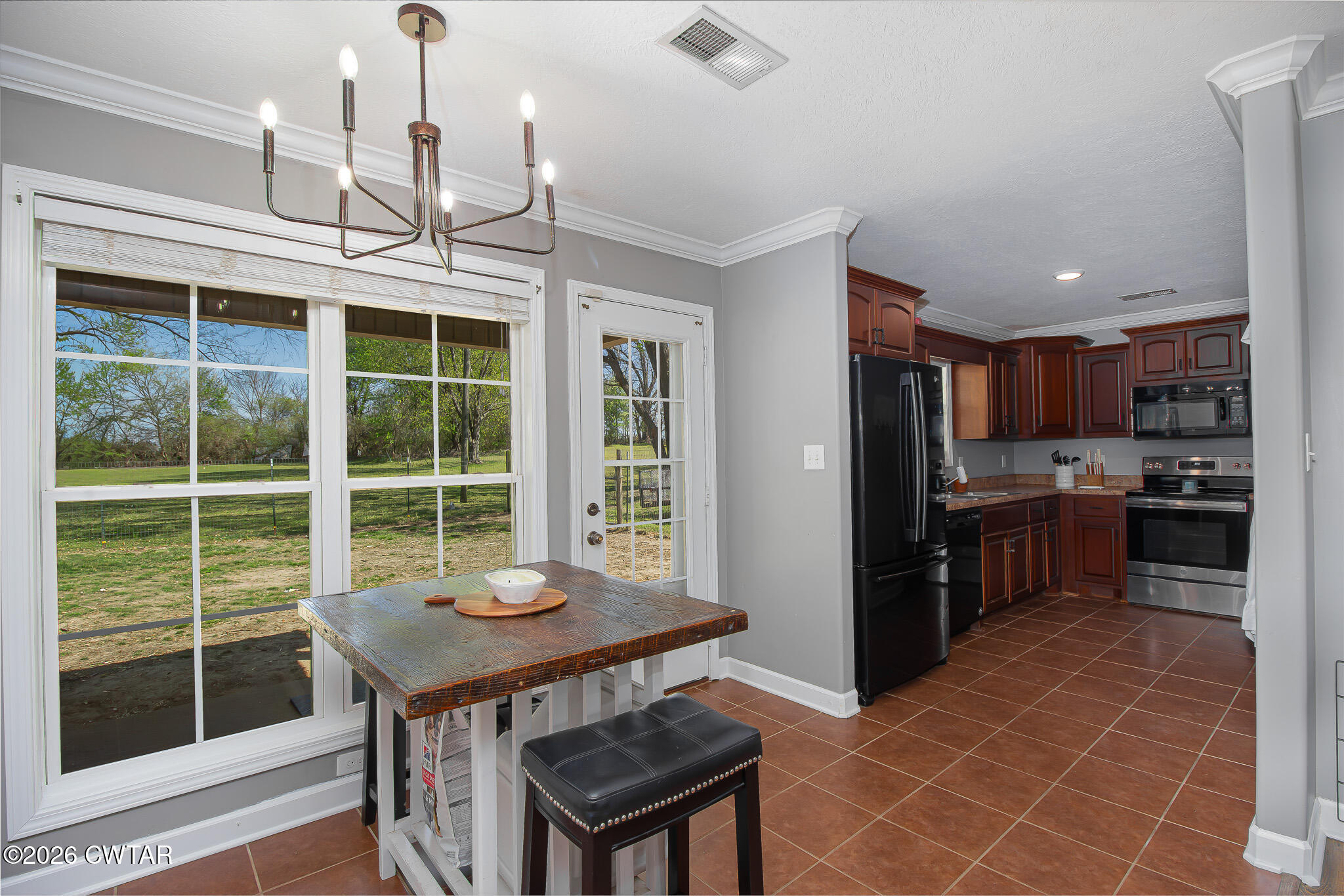 916 Landfill Road Brownsville, TN 38012 - Photo 10 of 21 a kitchen with stainless steel appliances granite countertop a sink a stove and a refrigerator