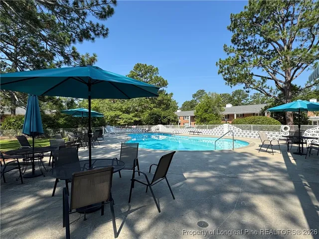 a view of chairs and tables in the patio