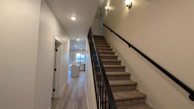 a view of entryway and hall with wooden floor