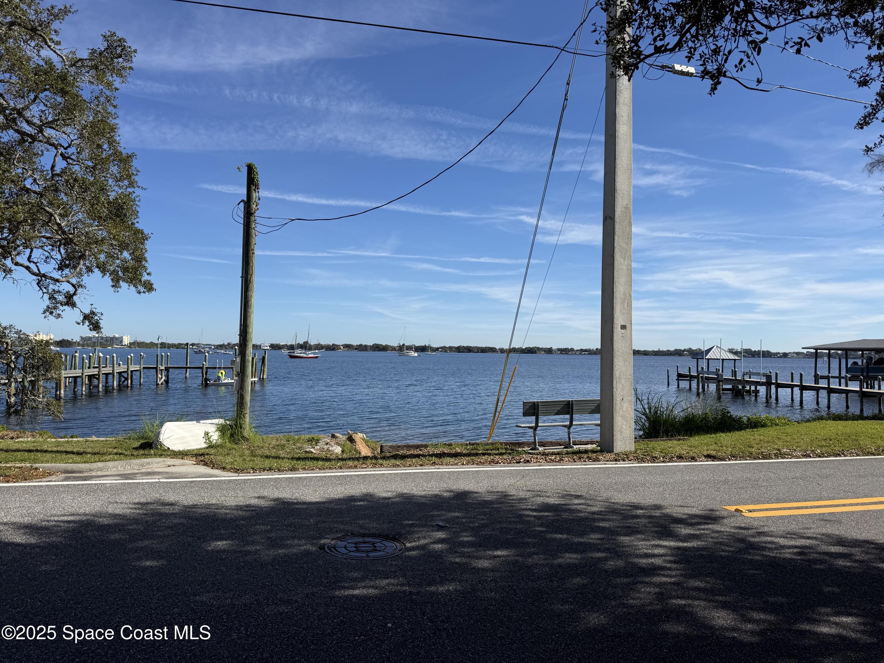 213 Sweet Street Rockledge, FL 32955 - Photo 24 of 38 a view of a swimming pool with an ocean view