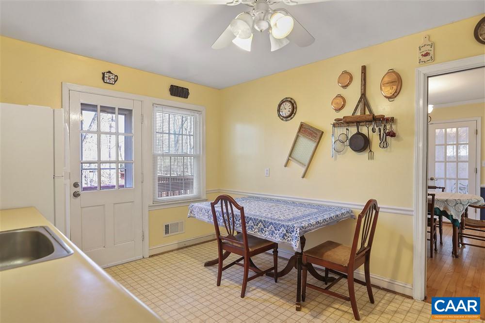 2807 Northfield Road Charlottesville, VA 22901 - Photo 14 of 35 a view of a dining room with furniture and chandelier