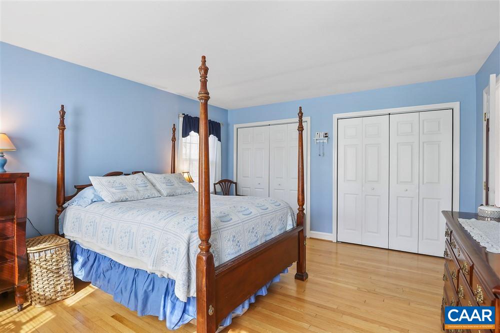 2807 Northfield Road Charlottesville, VA 22901 - Photo 17 of 35 a bedroom with a bed and wooden floor