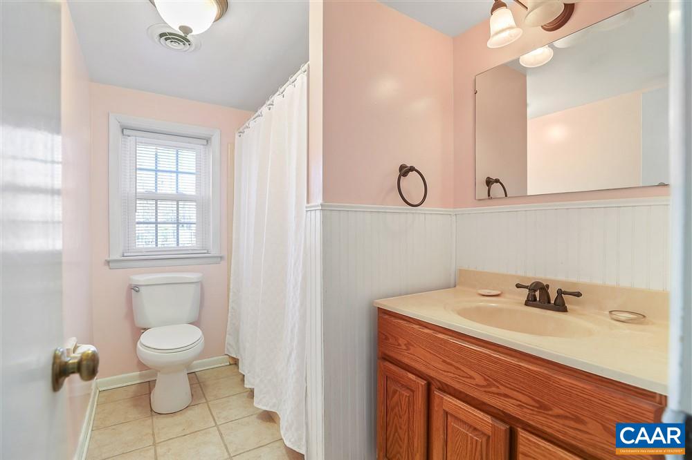 2807 Northfield Road Charlottesville, VA 22901 - Photo 25 of 35 a bathroom with a sink a toilet and a large mirror
