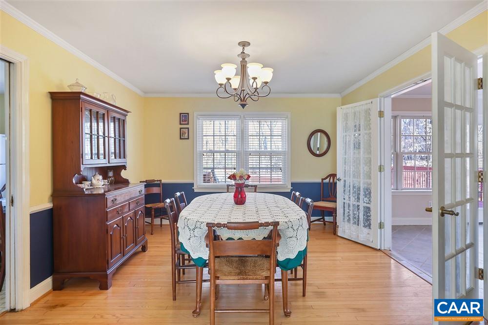 2807 Northfield Road Charlottesville, VA 22901 - Photo 9 of 35 a view of a dining room with furniture window and wooden floor