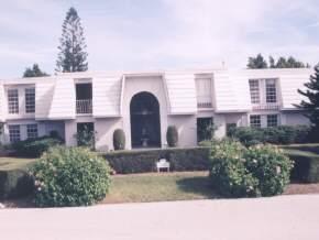 2175 Ibis Isle Road, Unit 2 Palm Beach, FL 33480 - Photo 1 of 1 a front view of a house with a yard