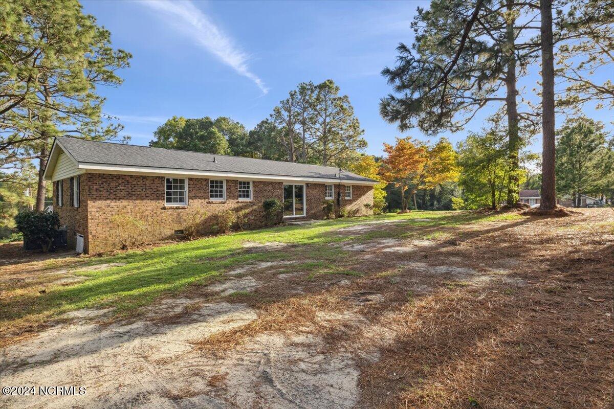 119 North Shore Trail Rockingham, NC 28379 - Photo 22 of 26 corner of backyard view