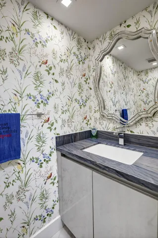 a bathroom with a sink and a mirror