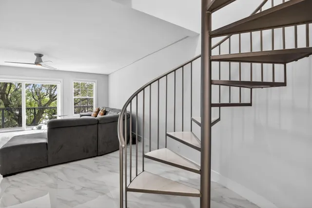 a view of entryway with wooden floor and a window