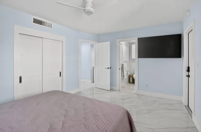 a view of a bedroom with a flat screen tv