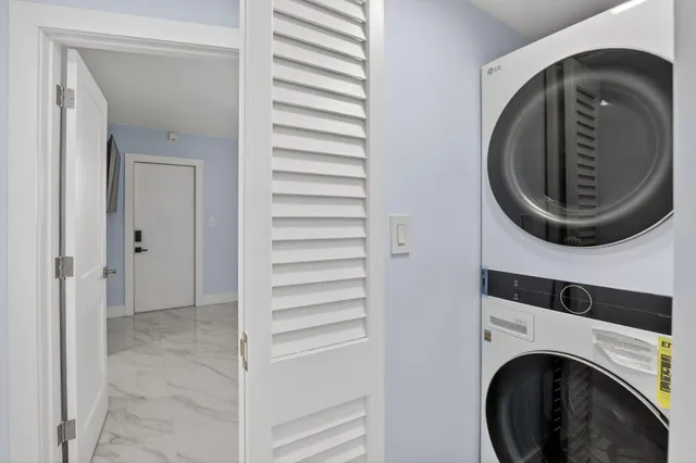 a view of a hallway with washer and dryer