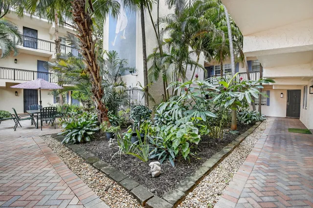 a view of a pathway with a patio