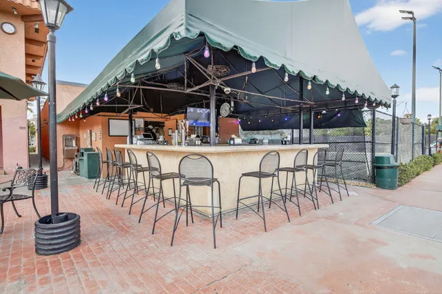 a view of a chairs and table in a patio