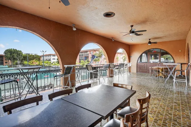 a view of a balcony dining table and chairs
