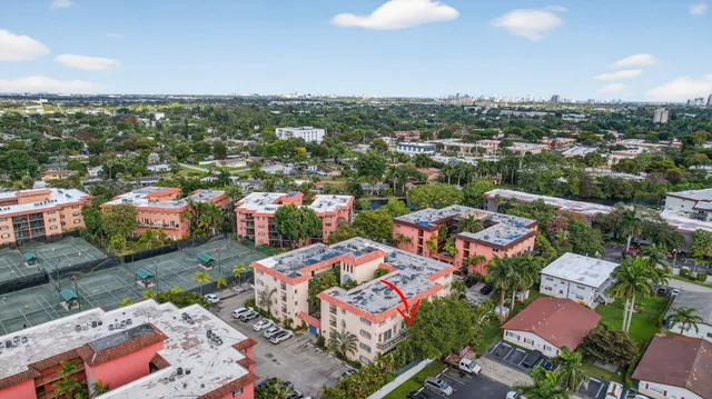 an aerial view of residential houses with outdoor space