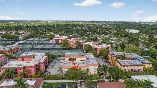 an aerial view of residential houses with outdoor space