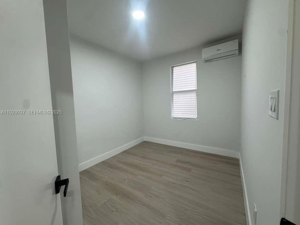 2425 Southwest 6th Street, Unit 16 Miami, FL 33135 - Photo 8 of 9 an empty room with a window