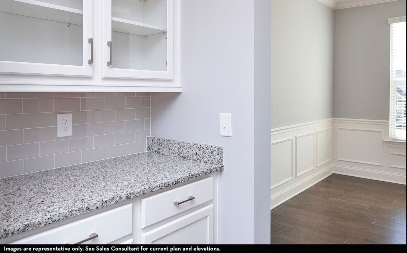 7925 Pine Street Fairview, TN 37062 - Photo 12 of 23 a kitchen with granite countertop a sink and a white stove