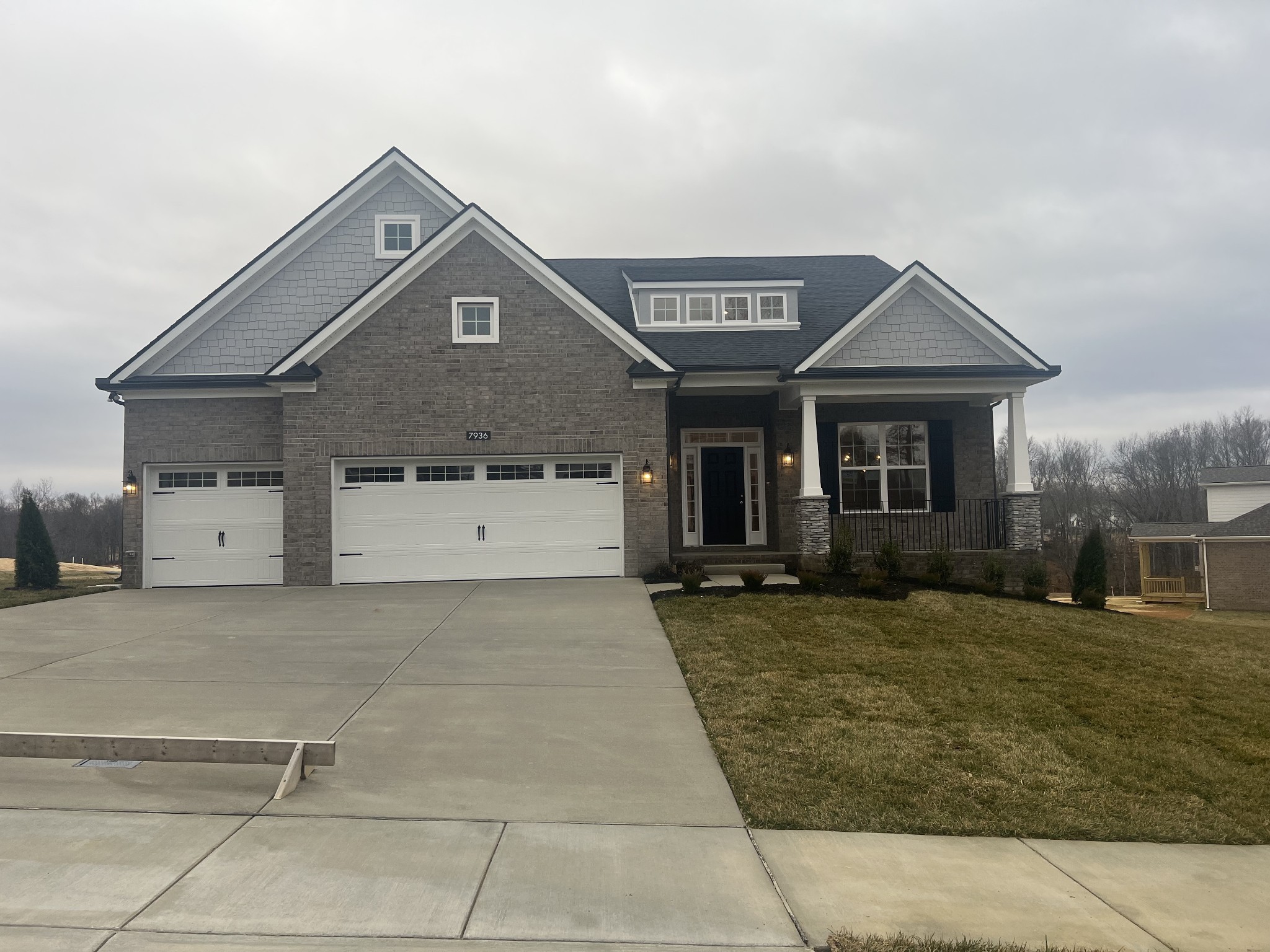 7925 Pine Street Fairview, TN 37062 - Photo 9 of 23 a front view of a house with a yard and garage