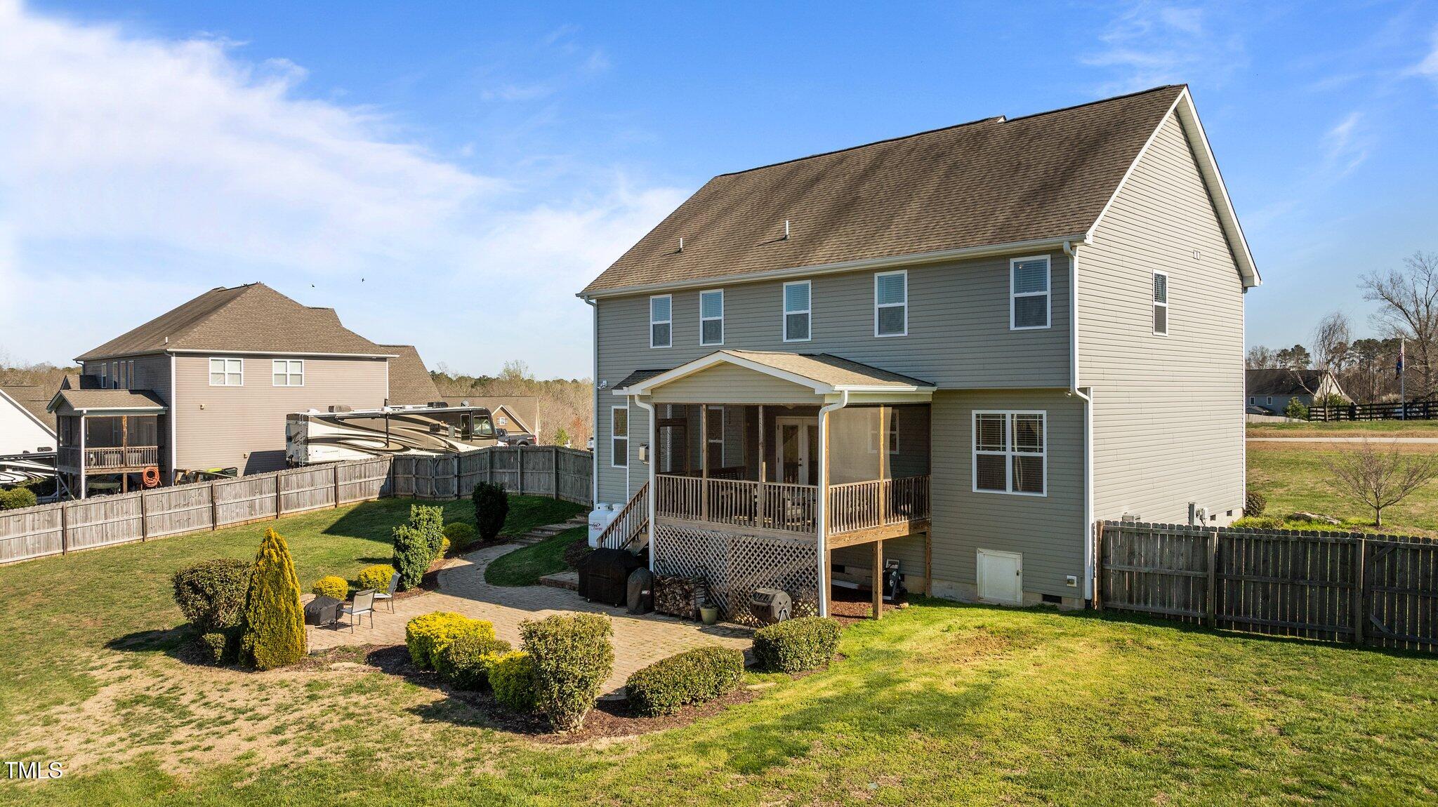 1036 Butterfly Circle Wake Forest, NC 27587 - Photo 11 of 51 a view of a house with backyard outdoor seating area and furniture