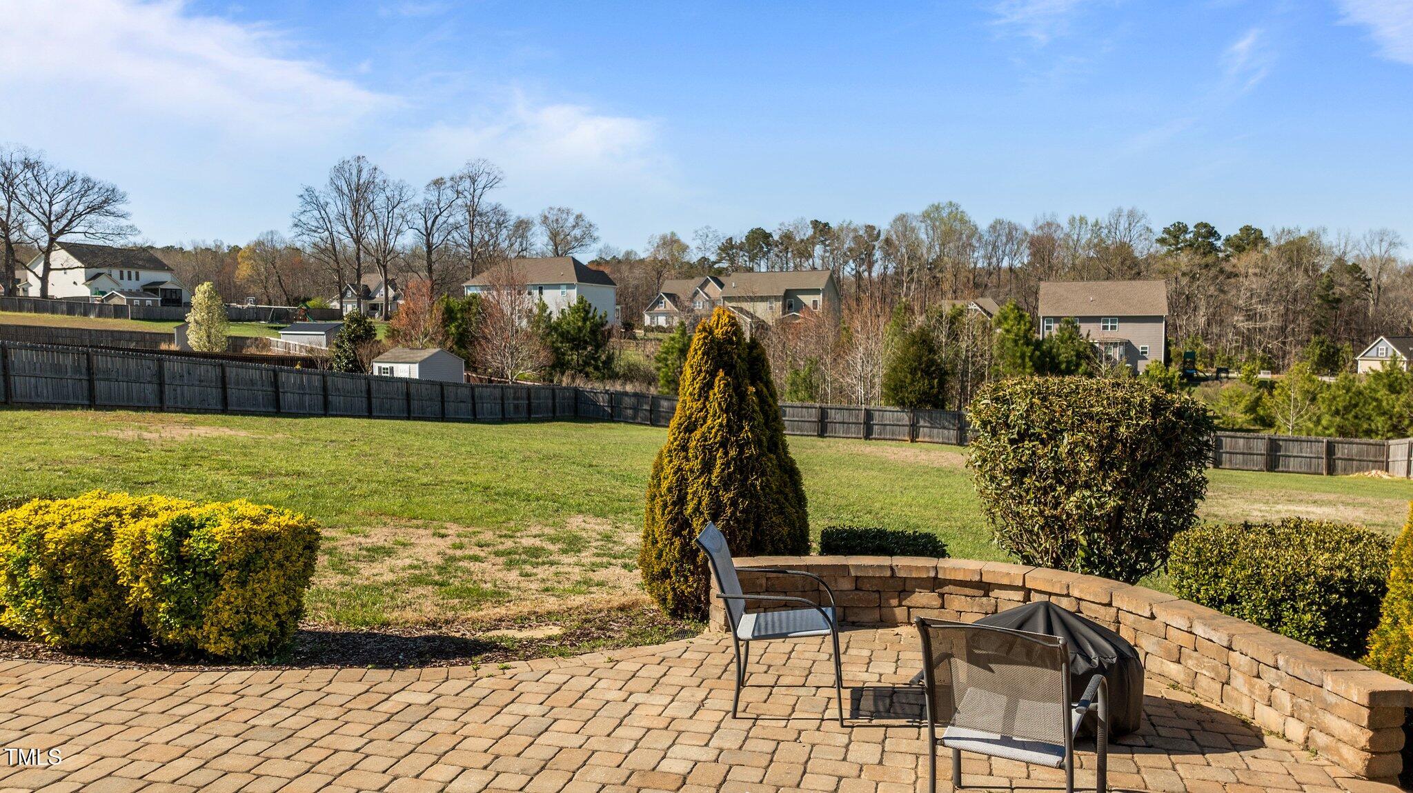1036 Butterfly Circle Wake Forest, NC 27587 - Photo 14 of 51 a view of a swimming pool with a garden