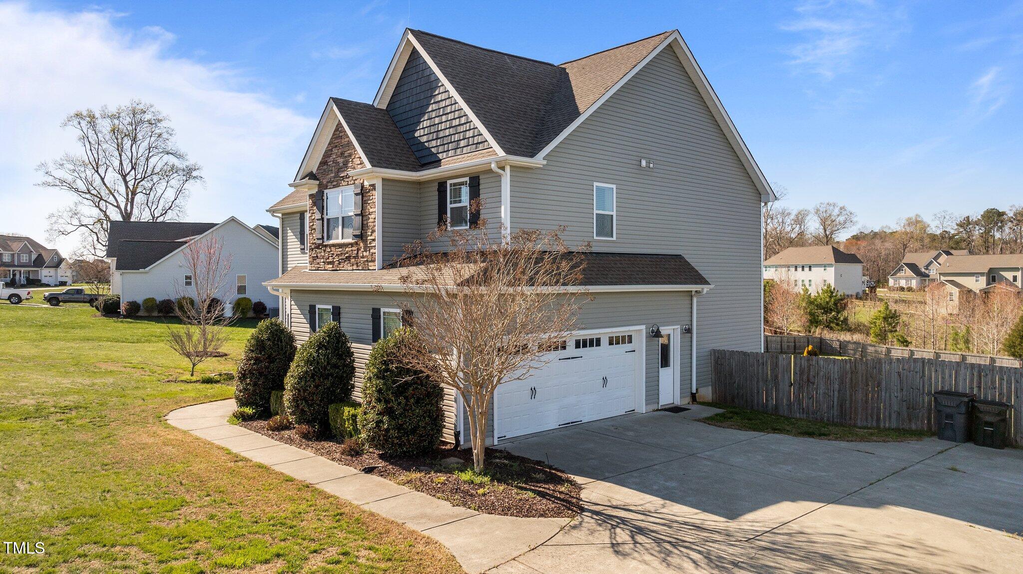 1036 Butterfly Circle Wake Forest, NC 27587 - Photo 19 of 51 a view of a house with a yard