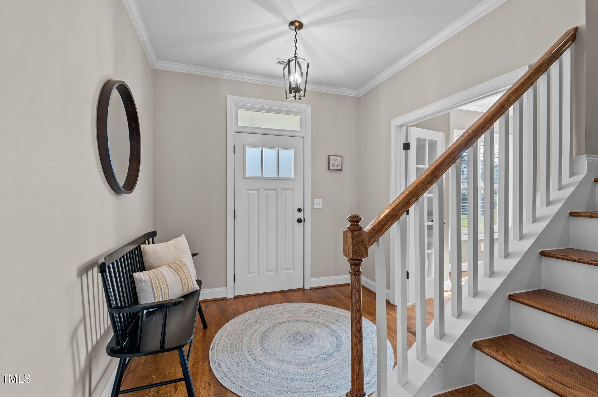 1036 Butterfly Circle Wake Forest, NC 27587 - Photo 22 of 51 a view of a livingroom with furniture entryway and wooden floor