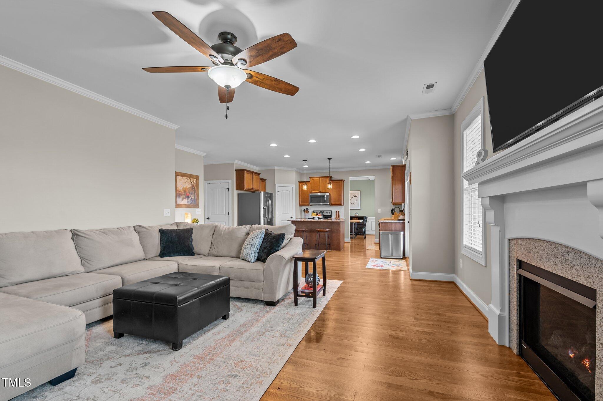 1036 Butterfly Circle Wake Forest, NC 27587 - Photo 28 of 51 a living room with furniture and a fireplace