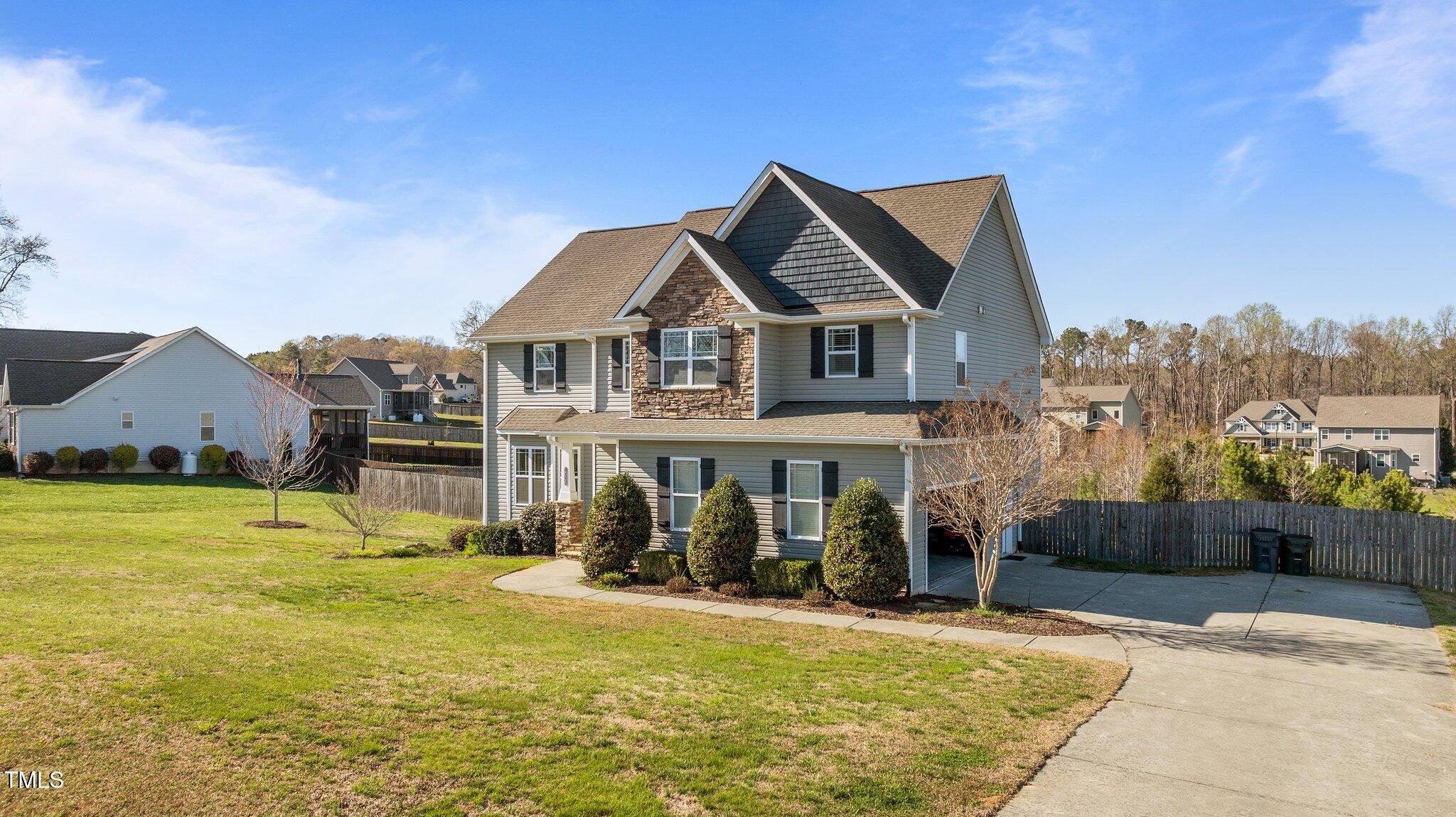 1036 Butterfly Circle Wake Forest, NC 27587 - Photo 2 of 51 a front view of a house with a yard