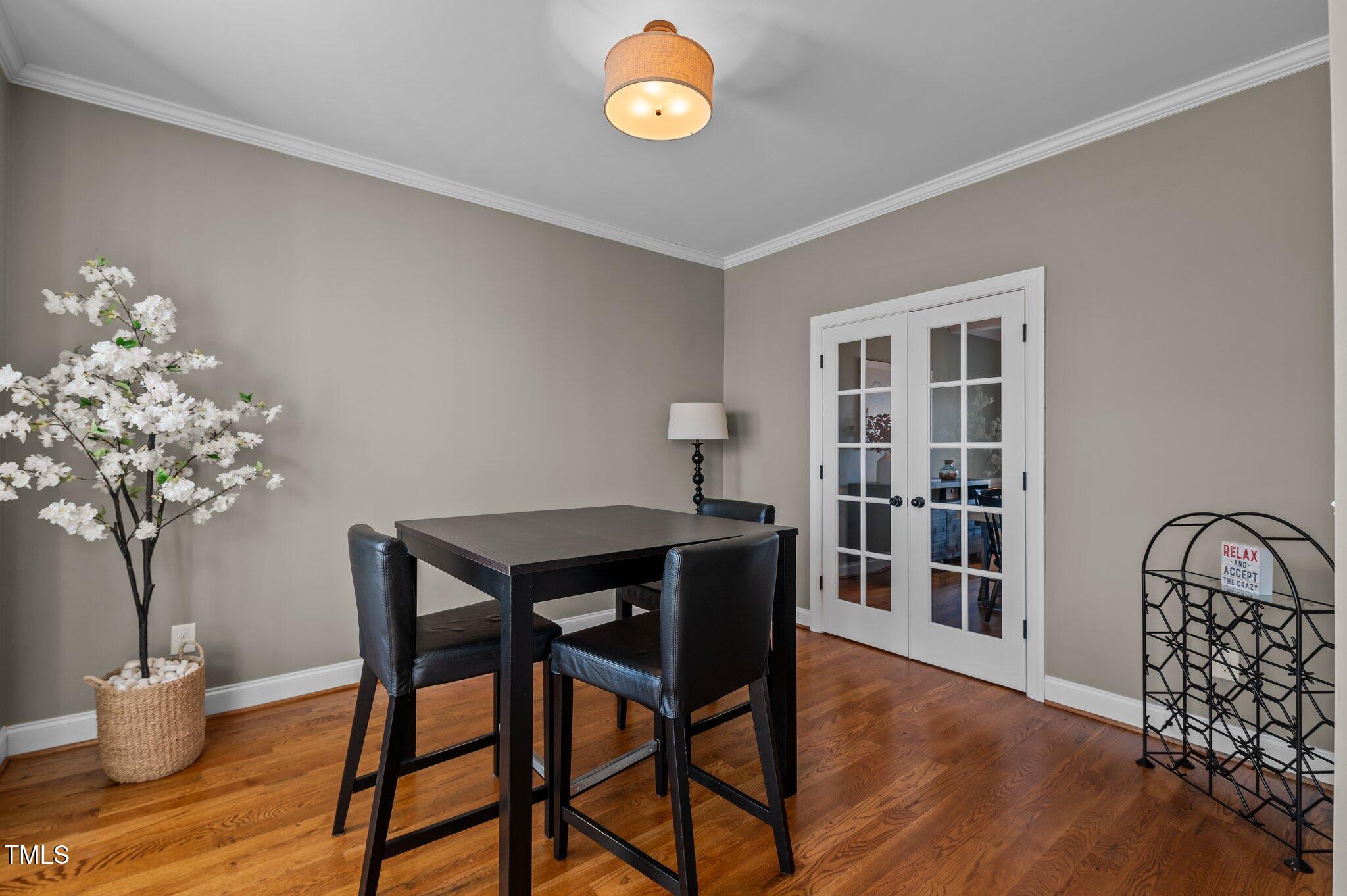 1036 Butterfly Circle Wake Forest, NC 27587 - Photo 37 of 51 a view of a dining room with furniture and wooden floor