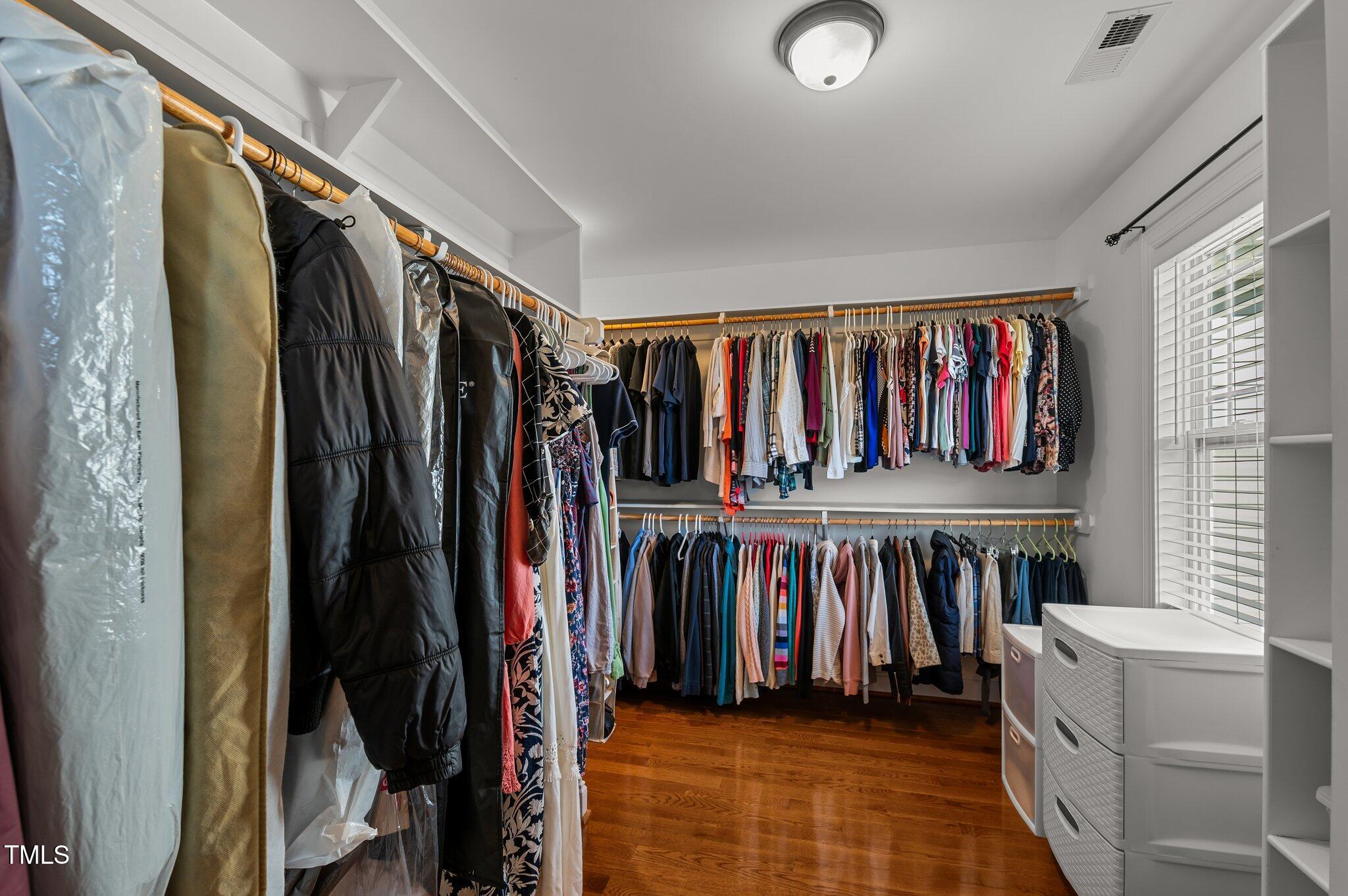 1036 Butterfly Circle Wake Forest, NC 27587 - Photo 44 of 51 a view of walk in closet with clothes and shoes