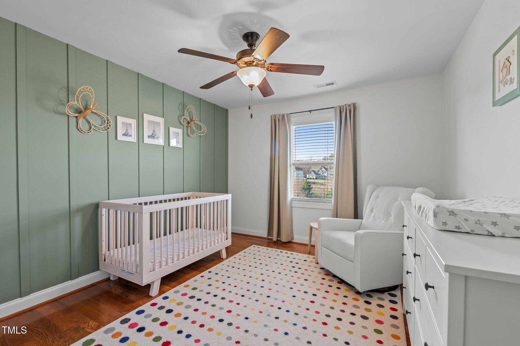 1036 Butterfly Circle Wake Forest, NC 27587 - Photo 46 of 51 a bedroom with a bed and a table