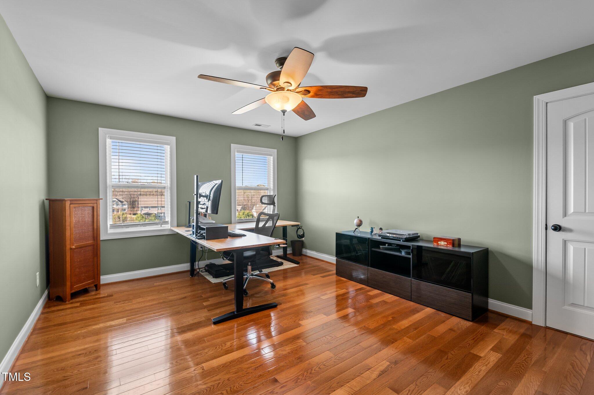 1036 Butterfly Circle Wake Forest, NC 27587 - Photo 47 of 51 a living room with furniture and wooden floor