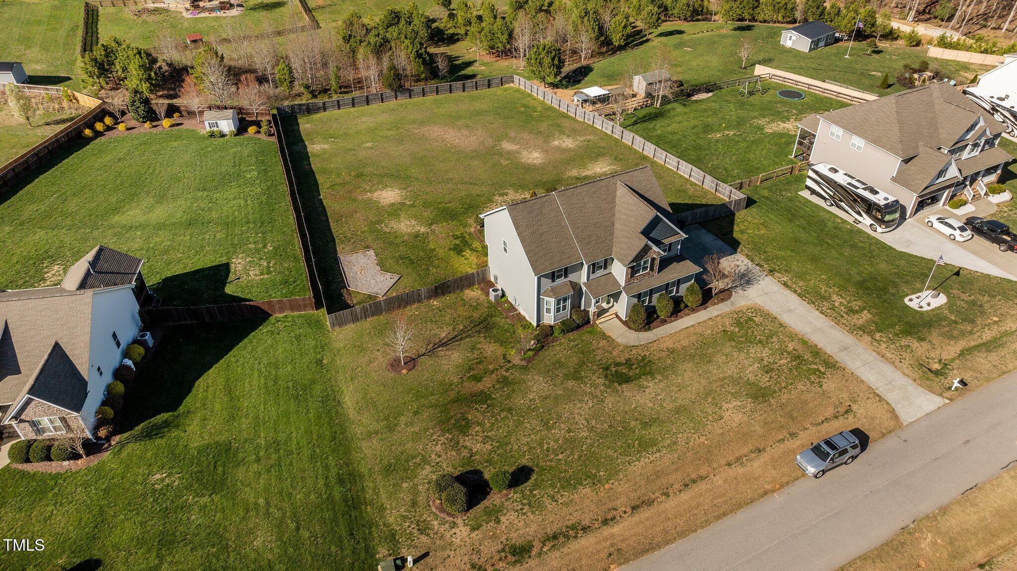 1036 Butterfly Circle Wake Forest, NC 27587 - Photo 6 of 51 an aerial view of a backyard with swimming pool