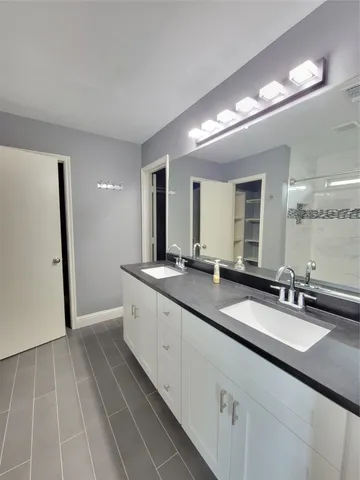 a bathroom with a tub and a shower