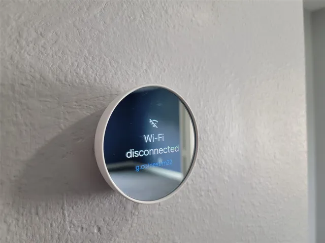 an empty room with windows and cabinet