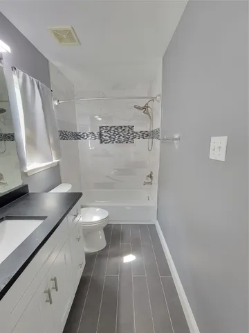 a view of balcony with wooden floor