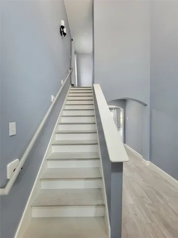 a view of an entryway with wooden floor