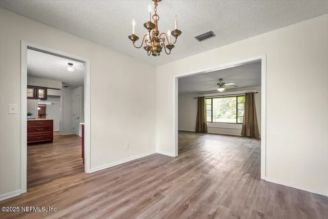 a kitchen with stainless steel appliances granite countertop a stove refrigerator and a sink